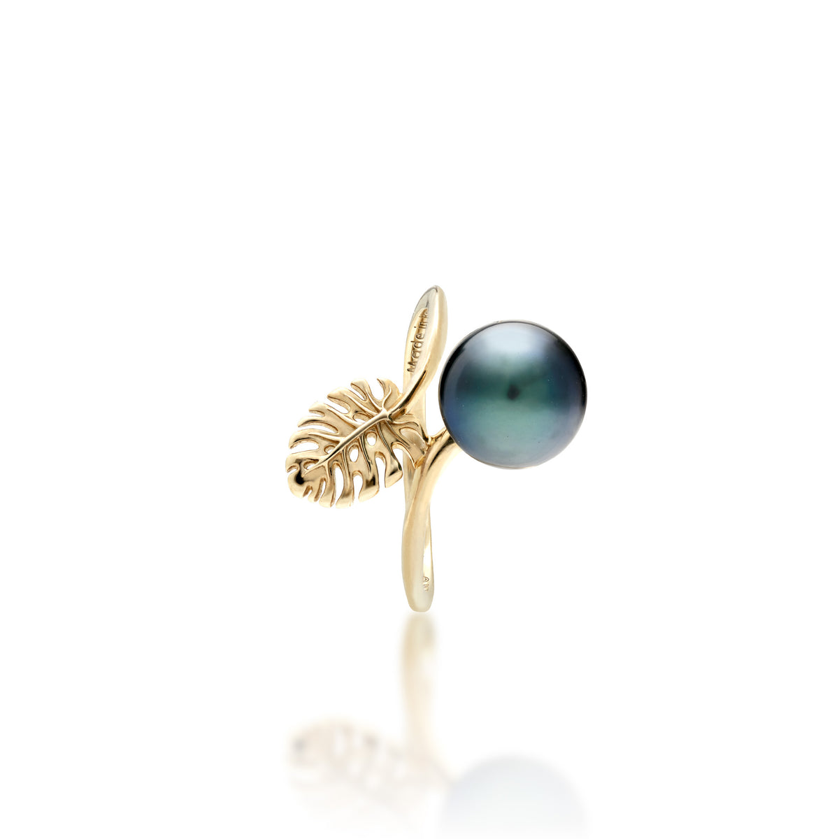 Side view of a 14k gold ring featuring a 8-9mm Tahitian Black pearl with a small cutout monstera leaf detail shown on a white background.