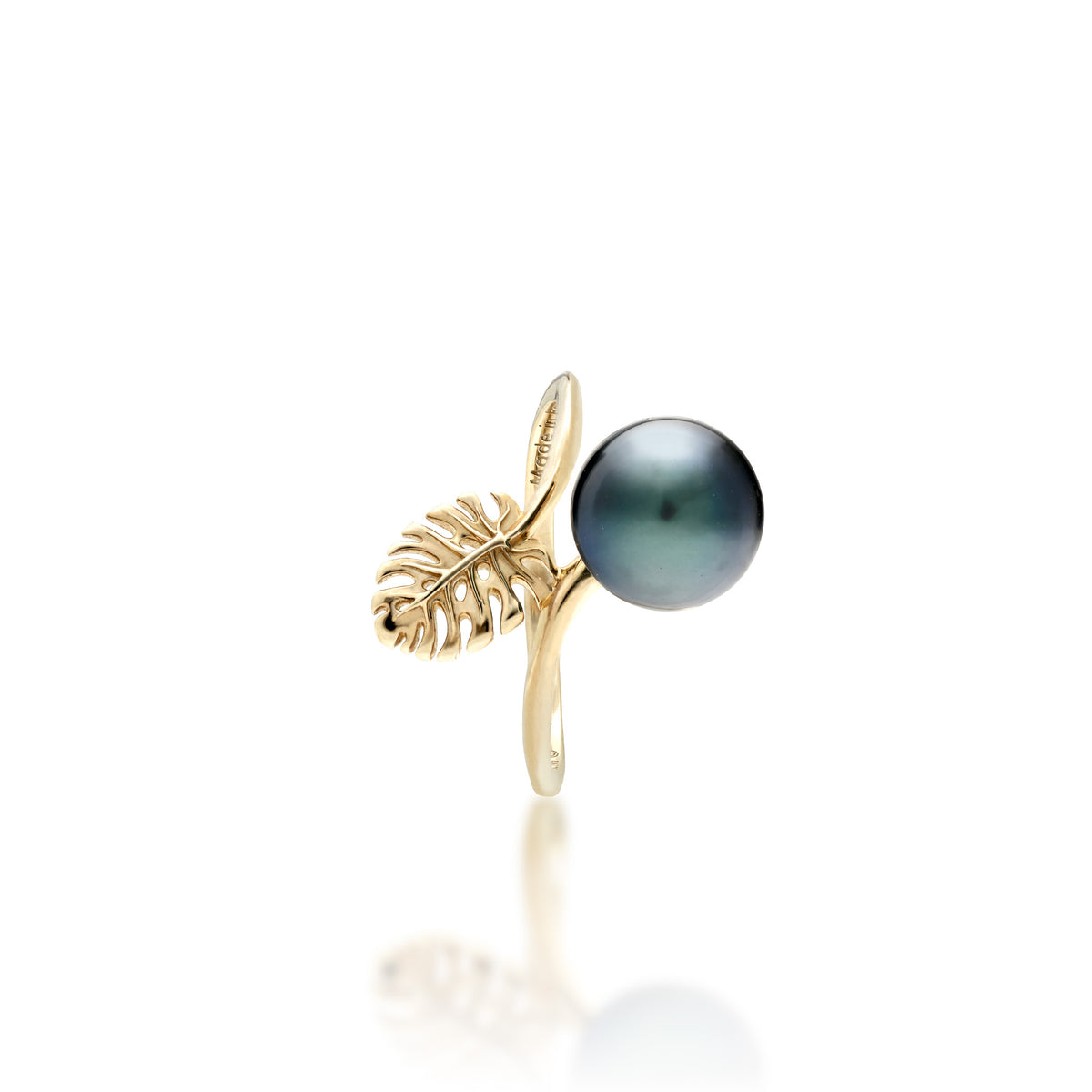 Side view of a 14k gold ring featuring a 8-9mm Tahitian Black pearl with a small cutout monstera leaf detail shown on a white background.