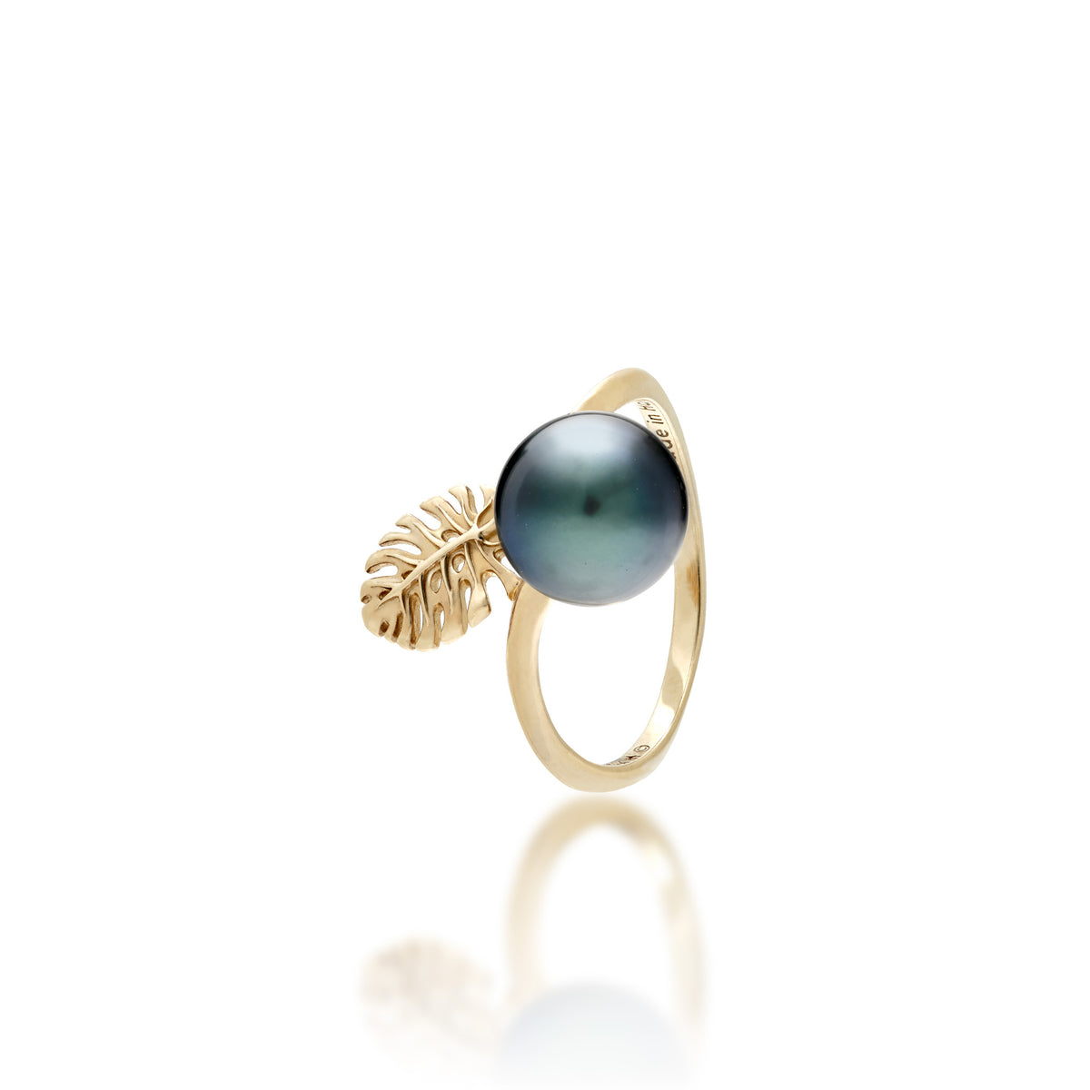 A 14k gold ring featuring a 8-9mm Tahitian Black pearl with a small cutout monstera leaf detail shown on a white background.