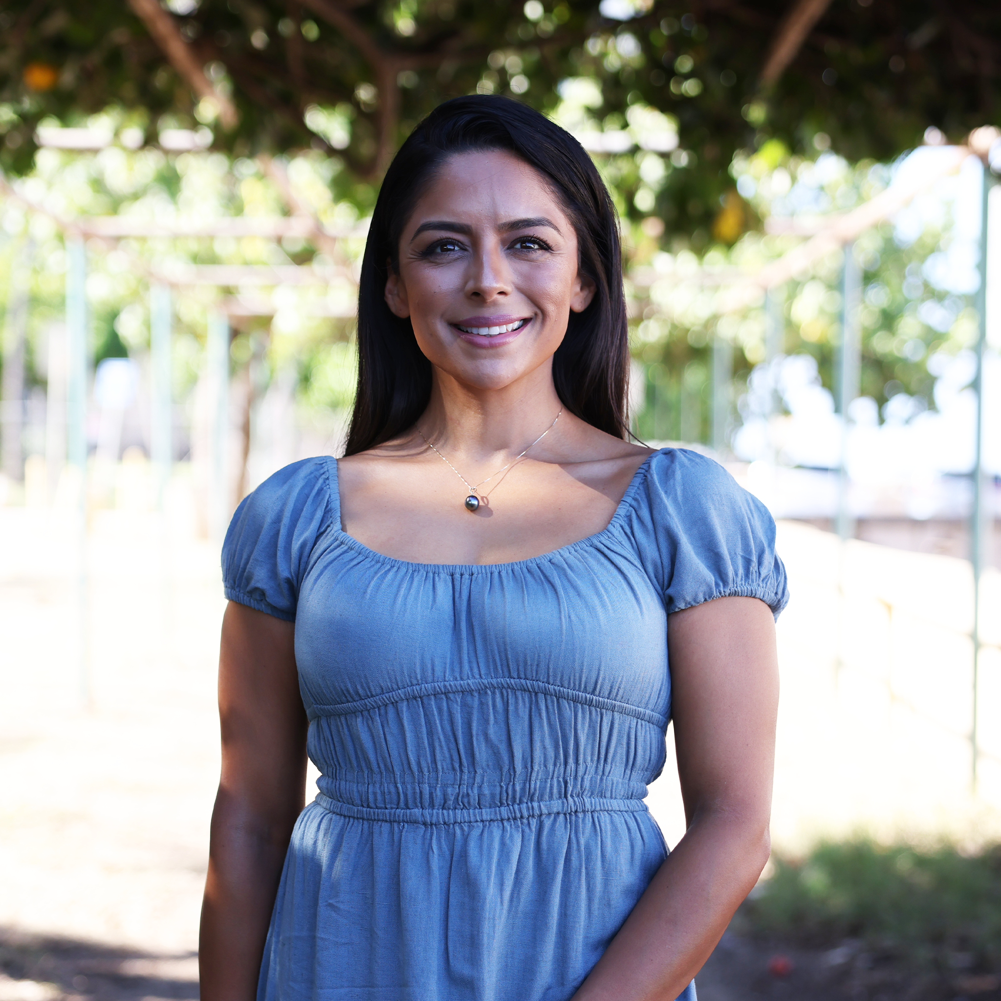 Tahitian Black Pearl Pendant in Gold with Diamonds on Woman with Nature Background - Maui Divers Jewelry