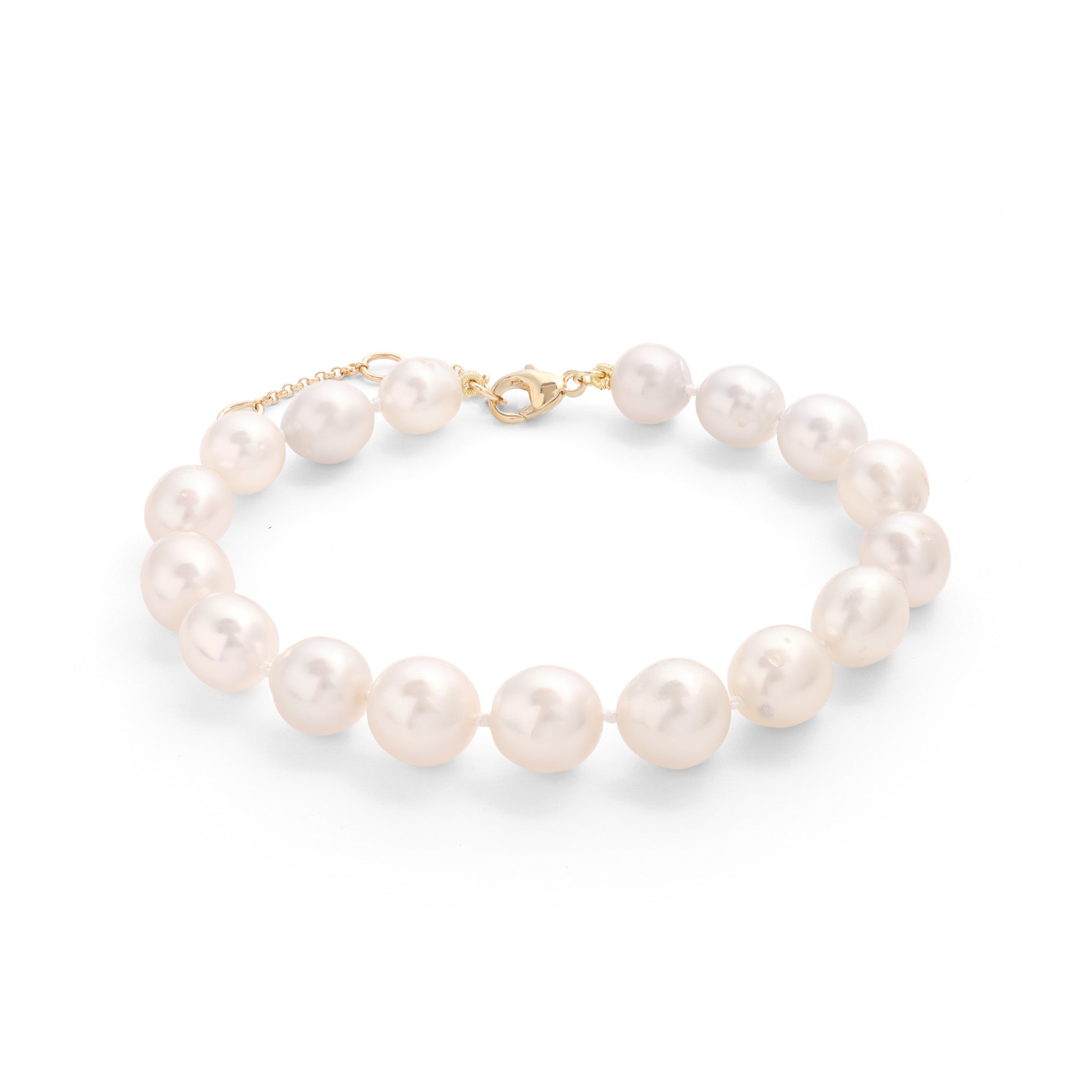 Side view of a South Sea Silver and White Pearl Bracelet with an adjustable gold clasp.