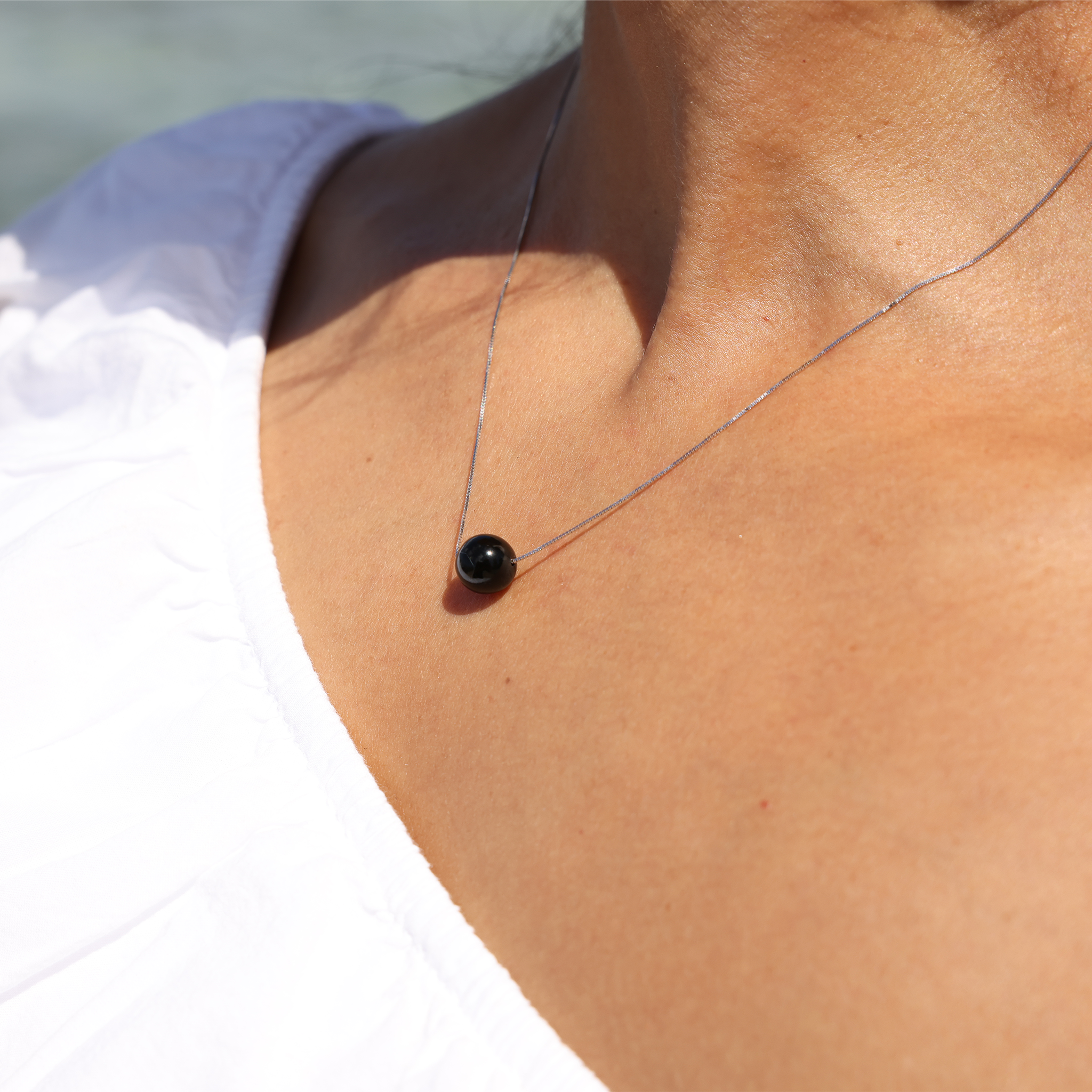 Model Wearing 18" Black Coral Slider Necklace in White Gold by Maui Divers Jewelry