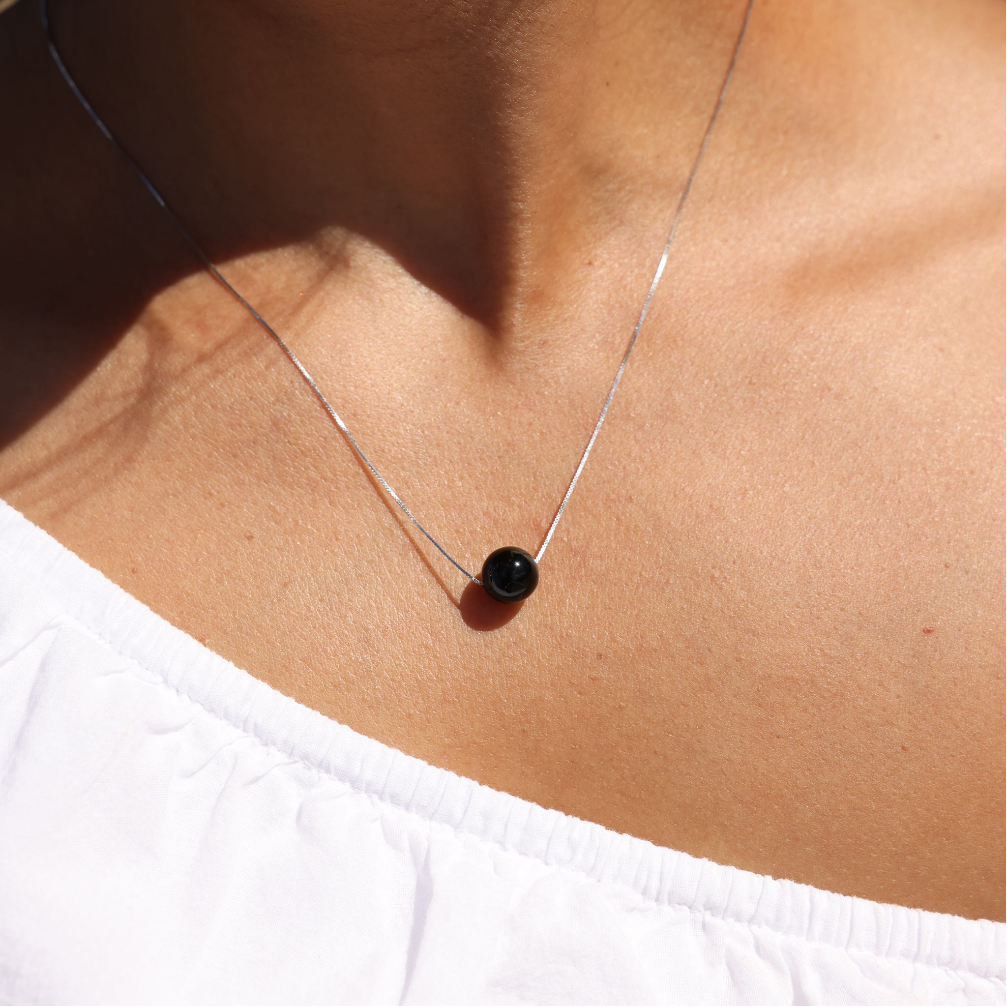 Model Wearing 18" Black Coral Slider Necklace in White Gold by Maui Divers Jewelry