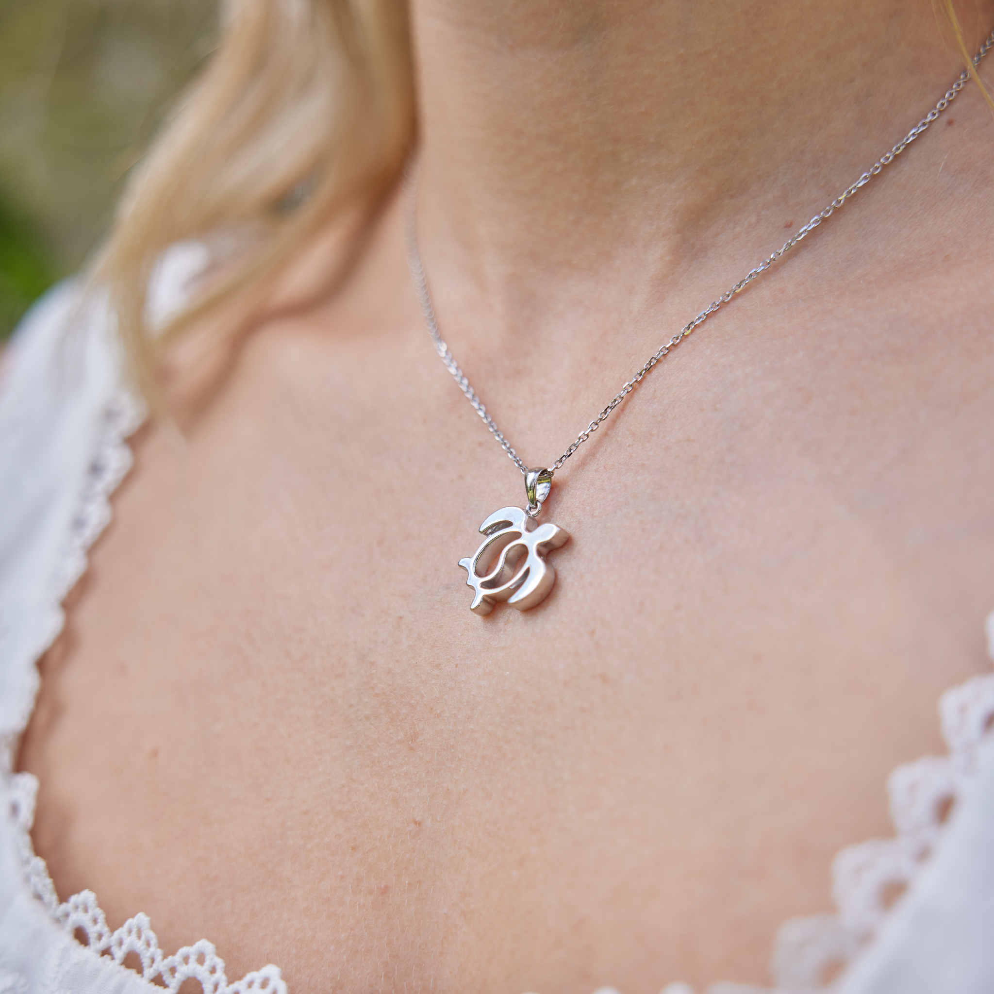 Honu Yin Yang Pendant in Sterling Silver on womanʻs neckline