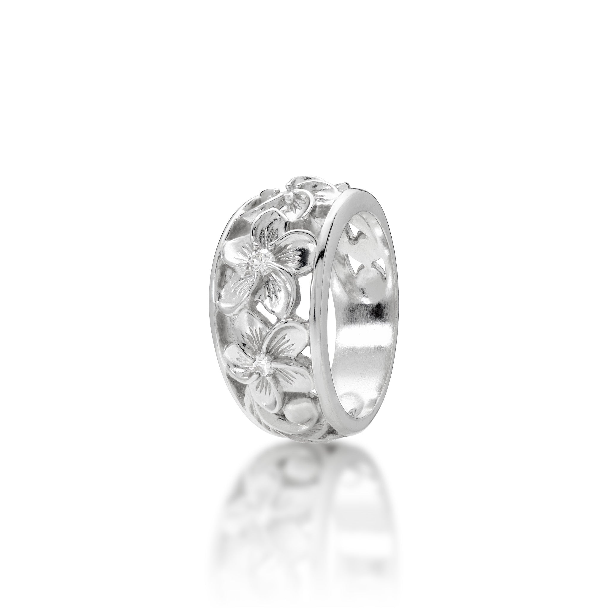 Angle view of the 11mm Hawaiian Heirloom Plumeria White Sapphire Ring in Sterling Silver on a white background