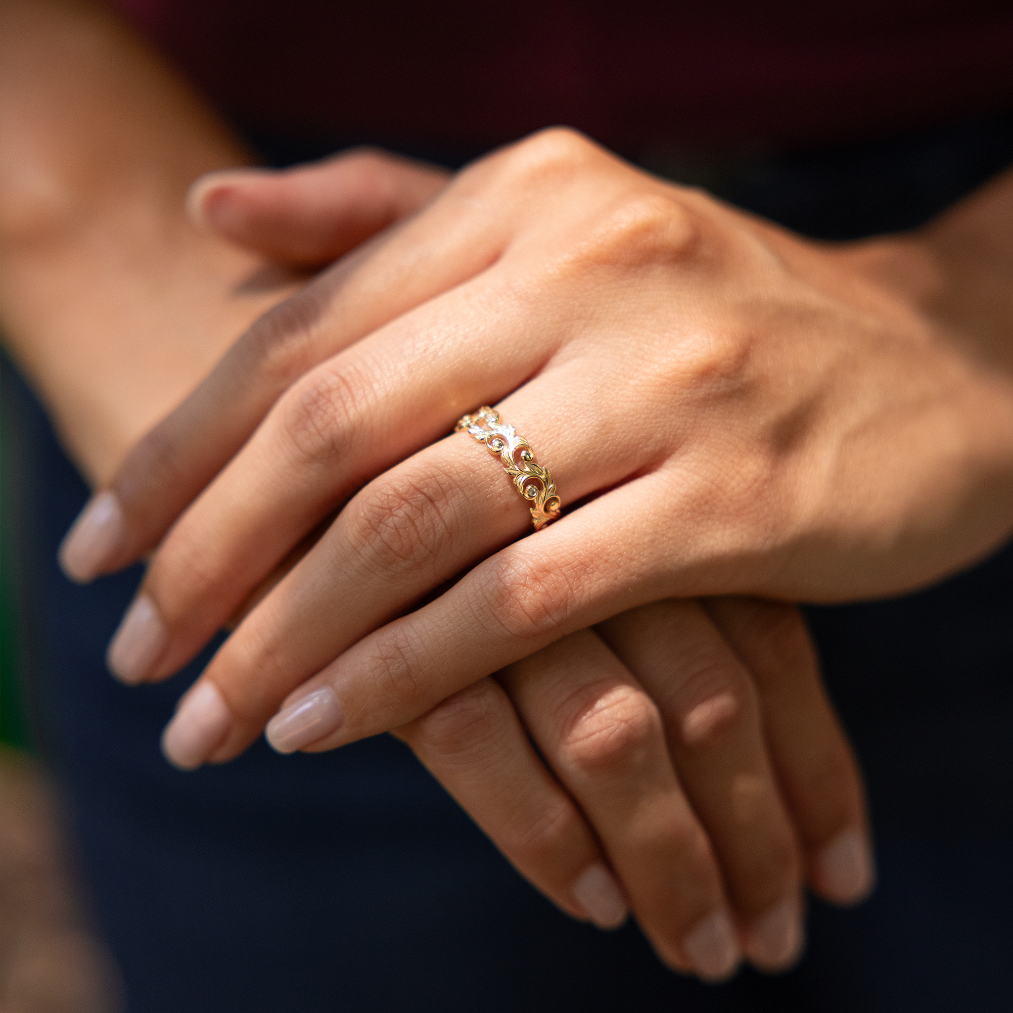 Woman's hands wearing a Living Heirloom Ring in 14k Yellow Gold with Diamonds