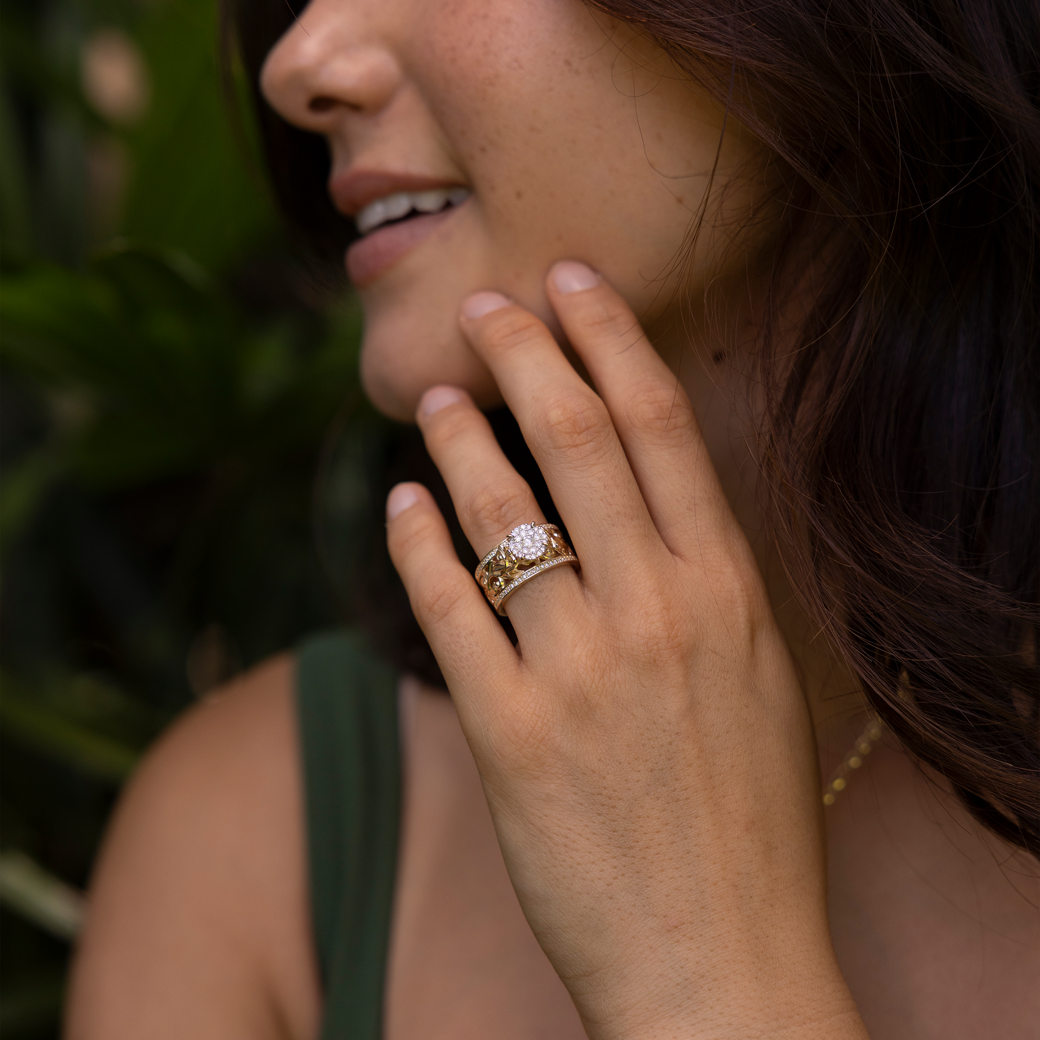Living Heirloom Engagement Ring in Gold with Diamonds on a woman in a garden