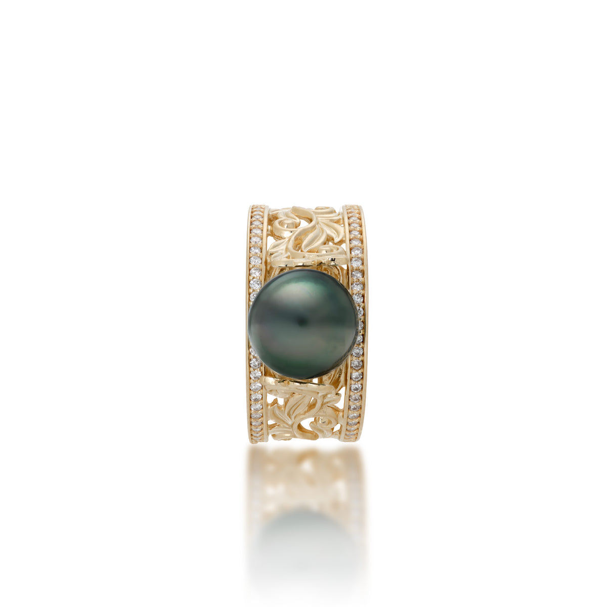 Top view of a 14k yellow gold ring with a wide band featuring a row of diamonds on each side and Living Heirloom Collection scrollwork with maile leaves and hāpuʻu ferns that meet a Tahitian black pearl at the crown, shown on a white background