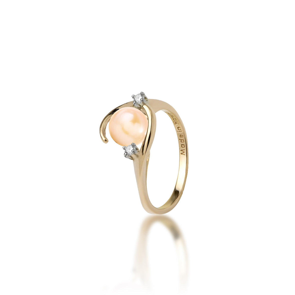 A 14k yellow gold ring with a high-polish finish featuring a round peach freshwater pearl accented by two small diamonds, shown on a clean white background with a soft reflection.