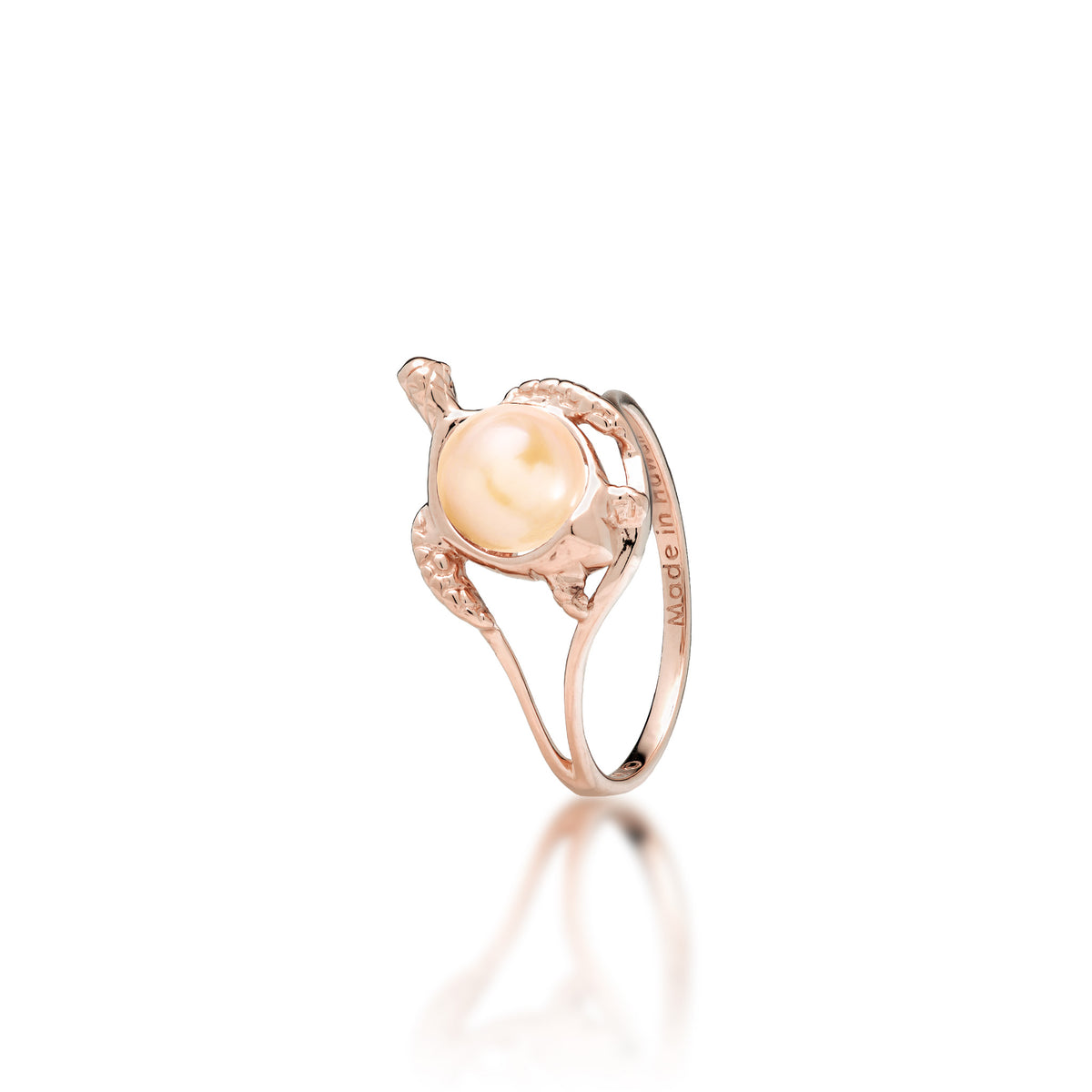 A 14k rose gold sea turtle ring with a peach freshwater pearl as its shell, shown on a white background