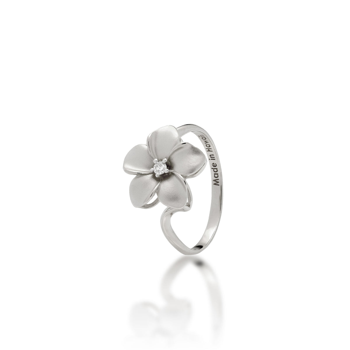 A 14k white gold 13mm plumeria flower ring with a diamond accent in the center and satin finished petals with high-polish edges, shown on a white background