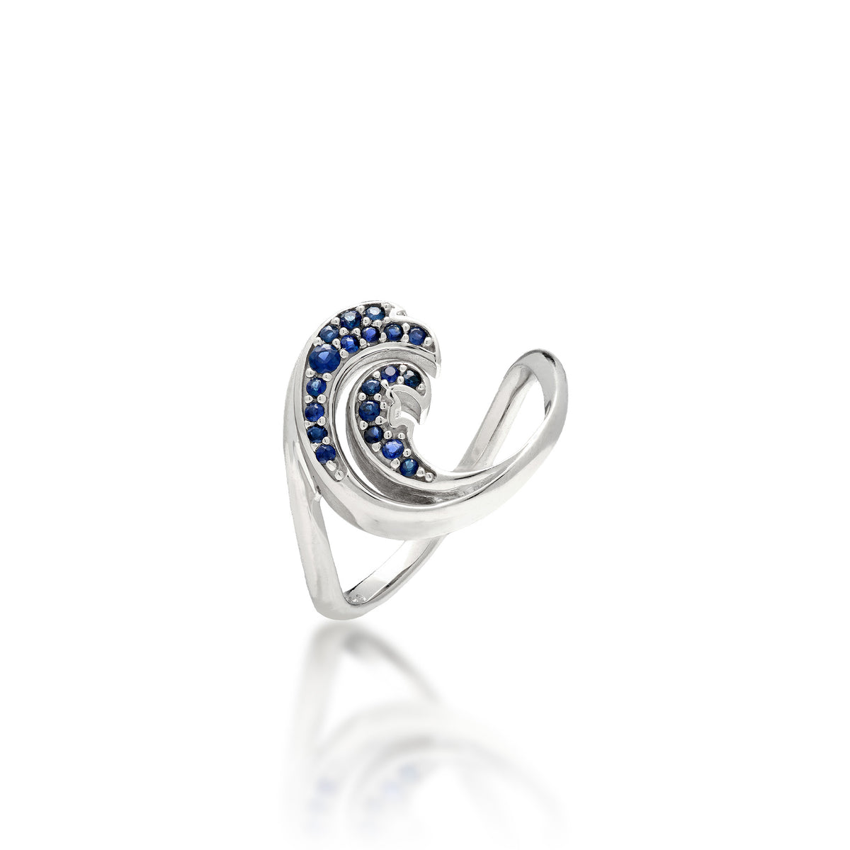 A Nalu (Wave) Ring in high-polish 14k white gold with a blue sapphire double-wave design, shown on a white background