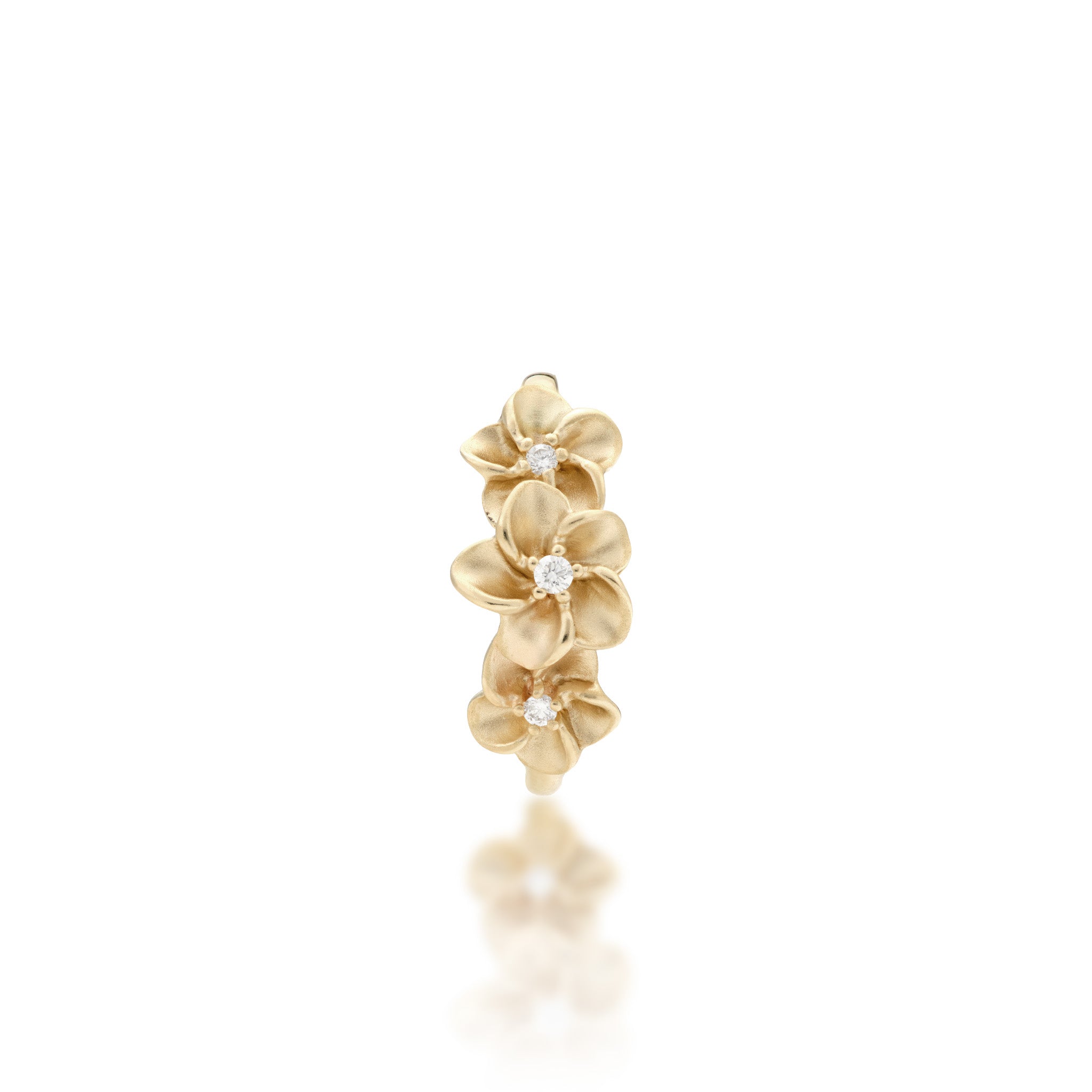 Top view of the Three Plumeria Ring in Gold with Diamonds on a white background