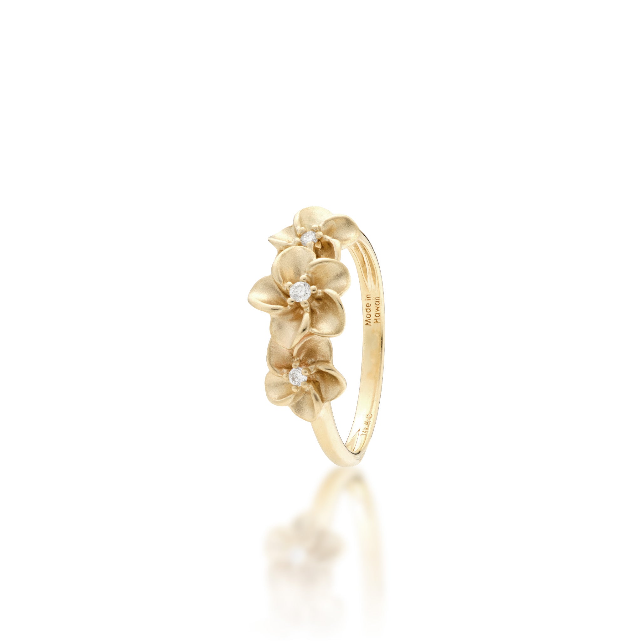 Angle view of the 8mm Three Plumeria Ring in Gold with Diamonds on a white background