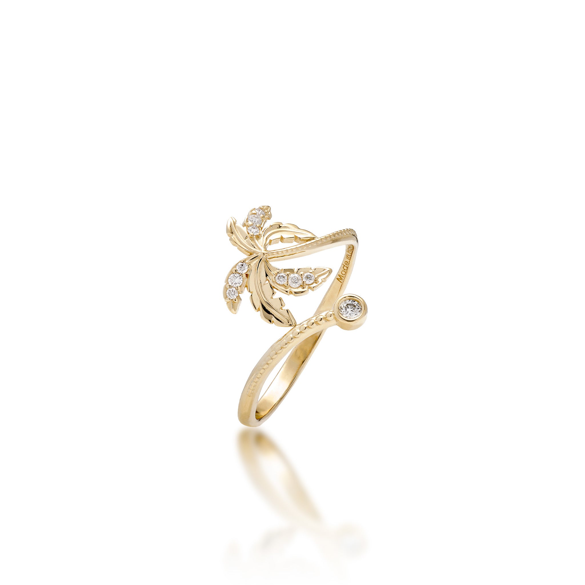 A 14k yellow gold palm tree design ring with high-polish and diamond-accented palm fronds and millegrain detailing along the bottom and a diamond accent at the bottom left curve of the ring, shown on a white background