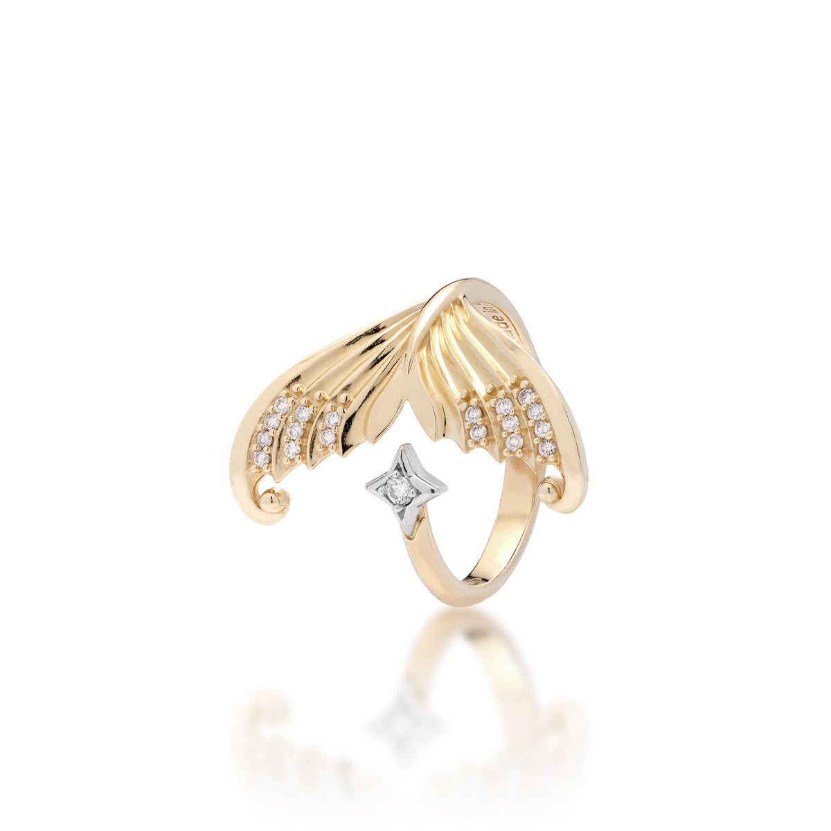A 14k yellow gold bypass mermaid tail ring with a high-polish finish and rows of diamonds along each side of the tail meeting a 14k white gold star with a diamond accent, shown on a white background