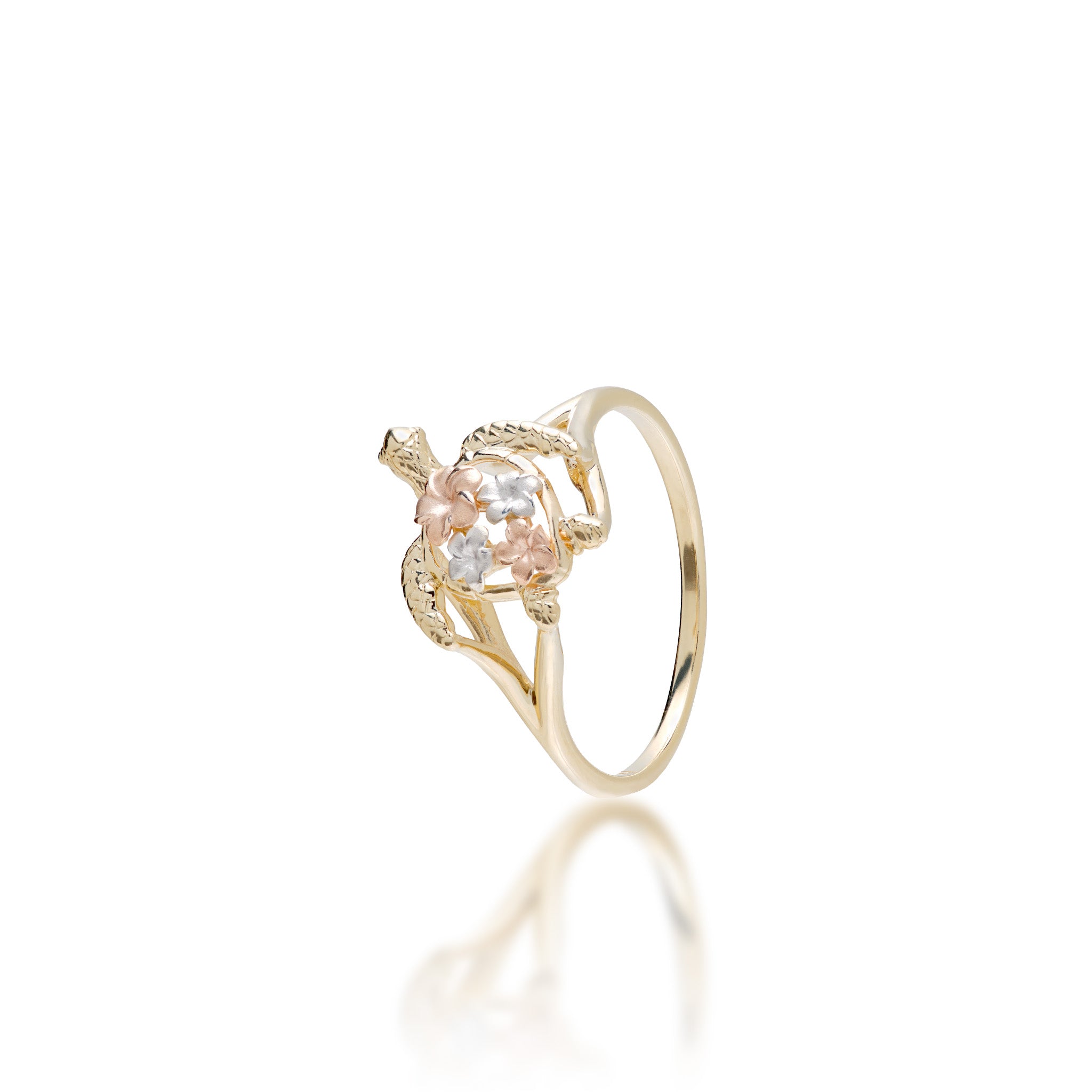 A 14k yellow gold Hawaiian green sea turtle ring with two rose gold plumeria flower and two white gold plumeria flowers at the shell, shown on a white background with a soft reflection