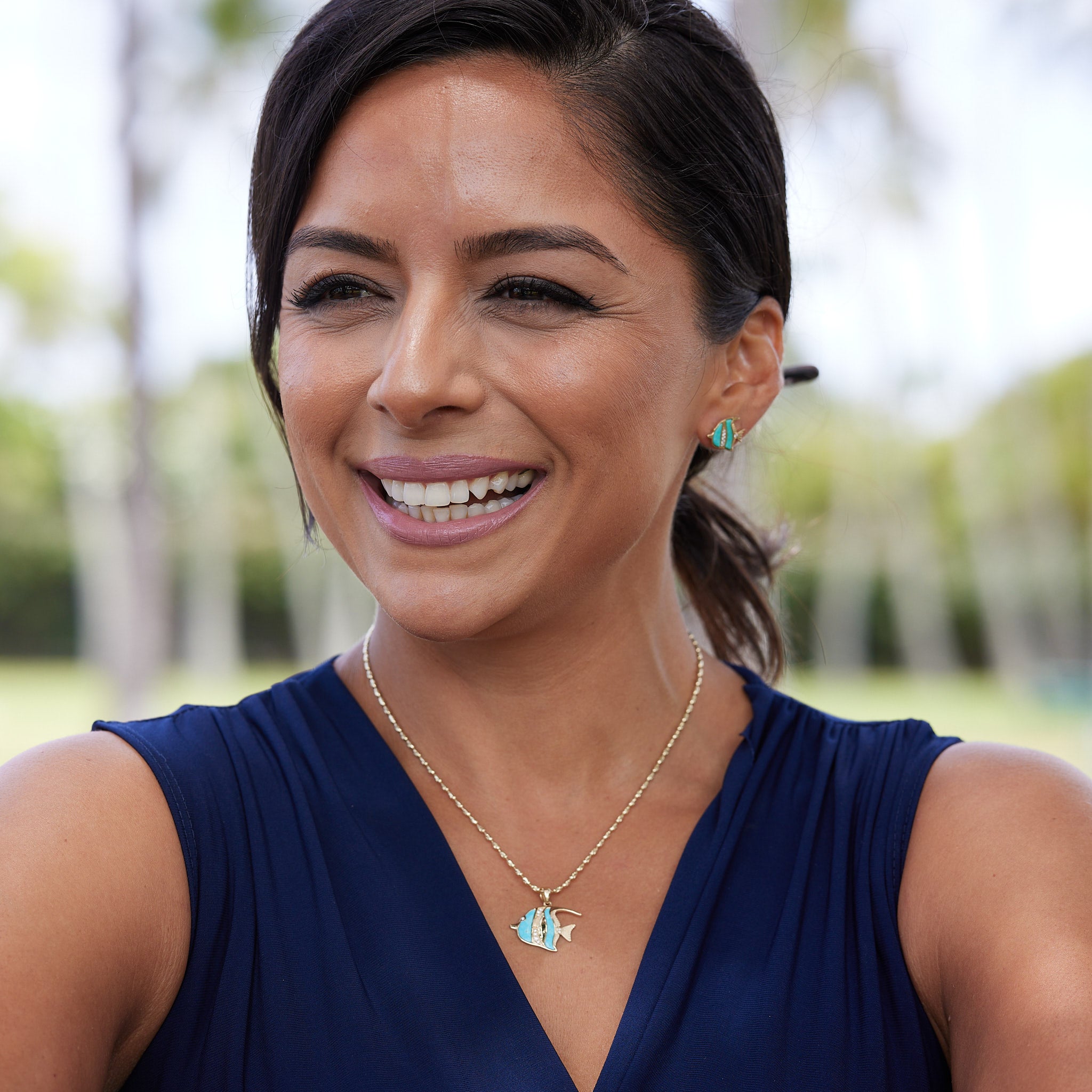 A woman wearing Sealife Angelfish Turquoise Earrings and Pendant in Gold with Diamonds - Maui Divers Jewelry