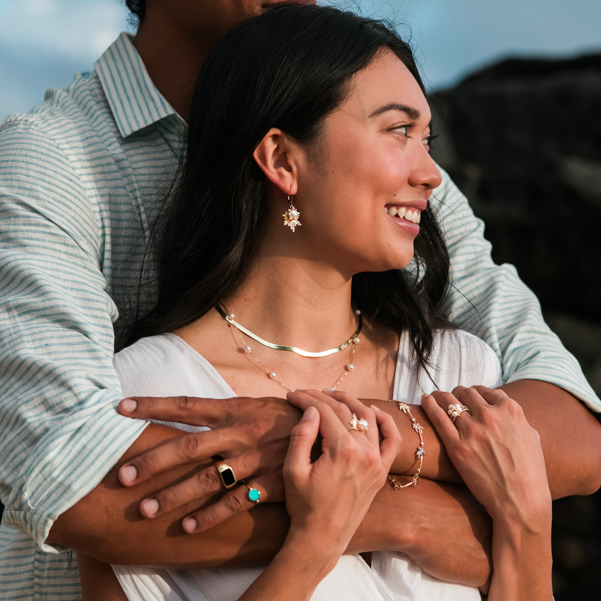 Couple embracing and the woman is wearing a 3.8mm Herringbone Chain in 14k Yellow Gold