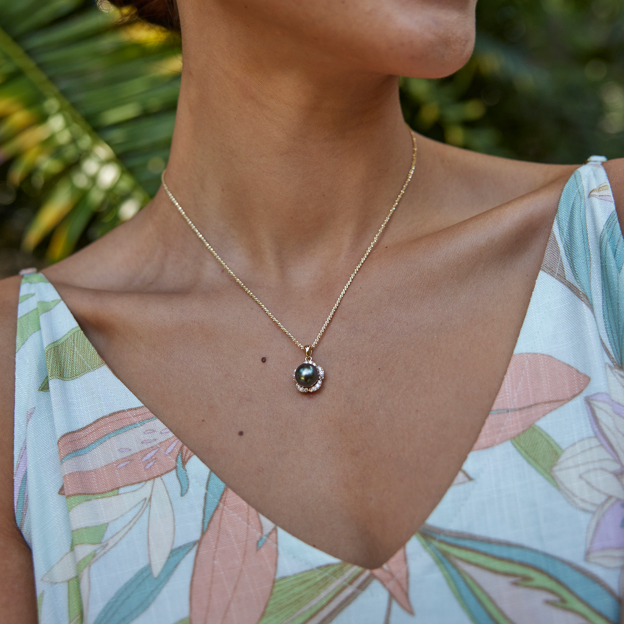 Model Wearing Plumeria Tahitian Black Pearl Pendant in Gold with Diamonds - 9-10mm