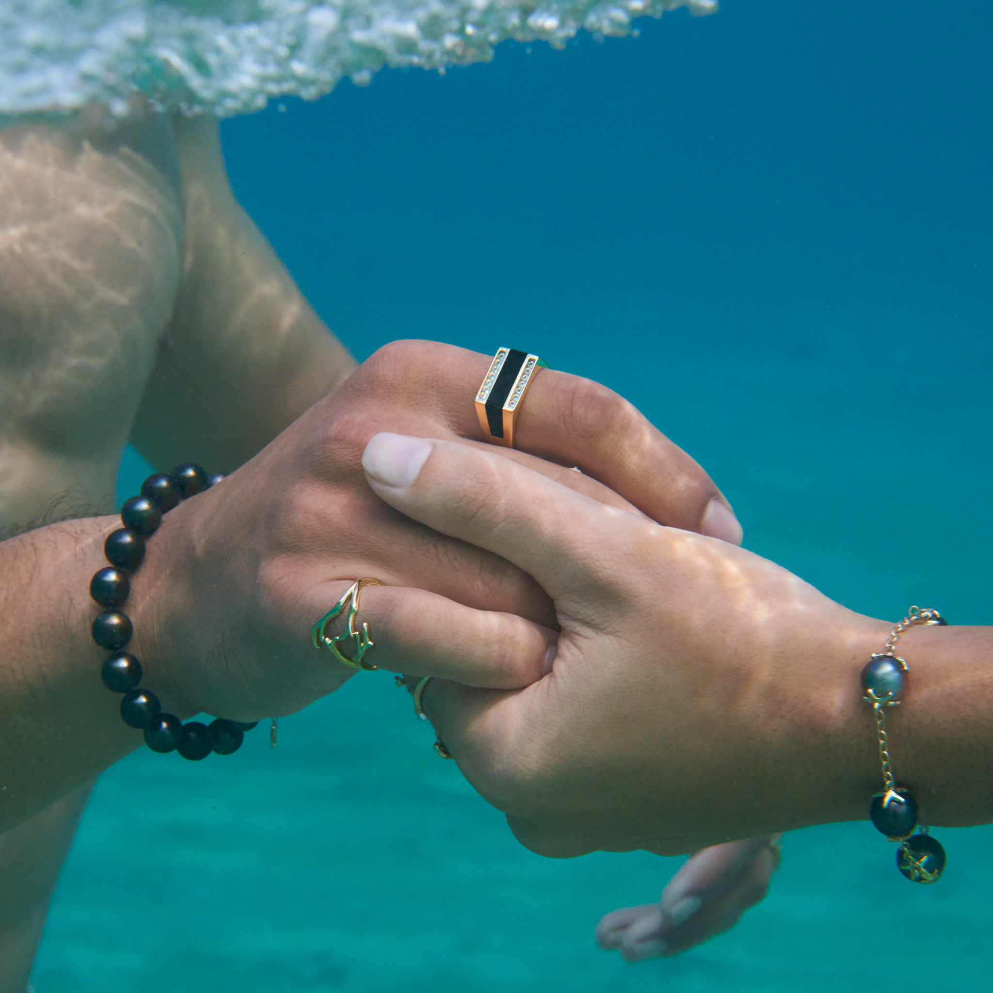 Hawaiian Black Coral Ring in Gold with Diamonds on Male Model underwater