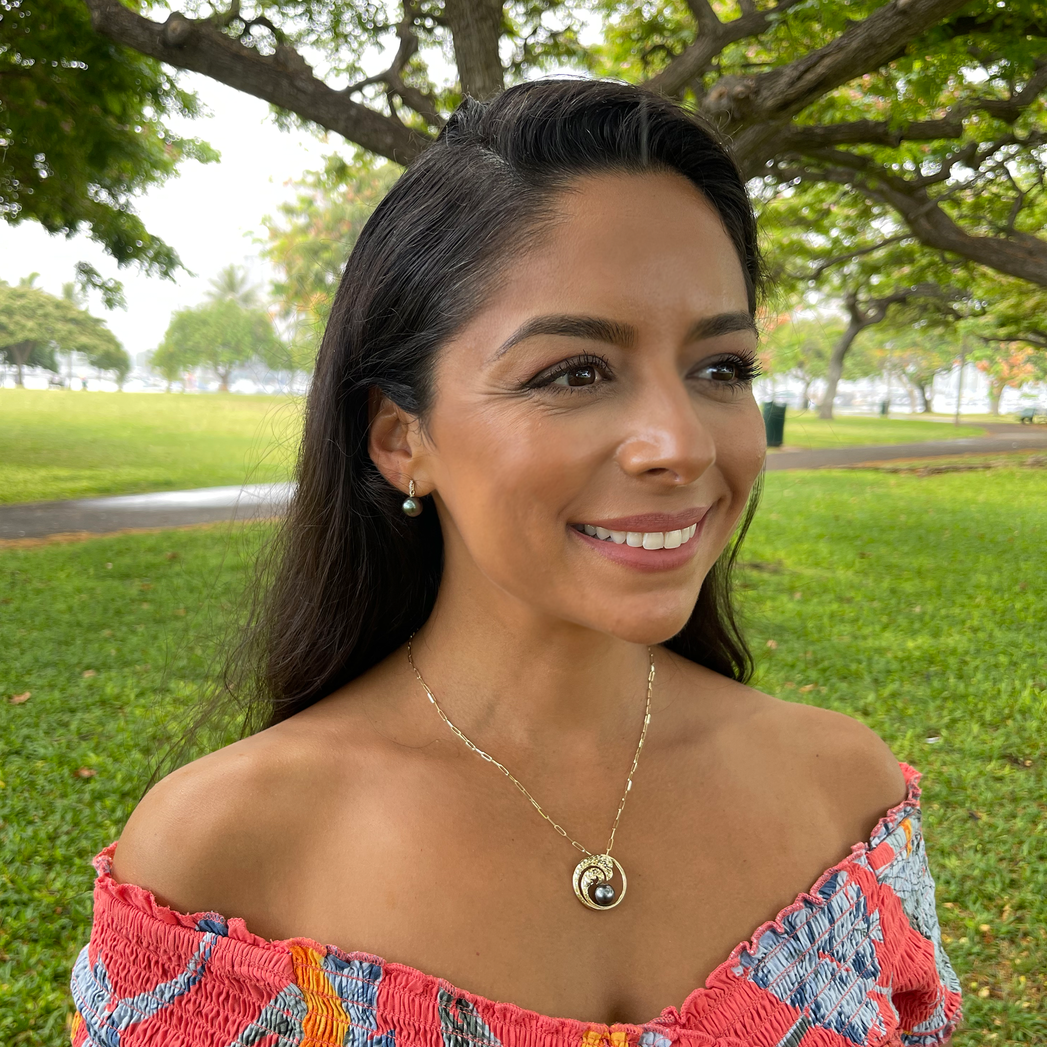 A woman wearing Tahitian Black Pearl Earrings in Gold with Diamonds - 9-10mm - Maui Divers Jewelry