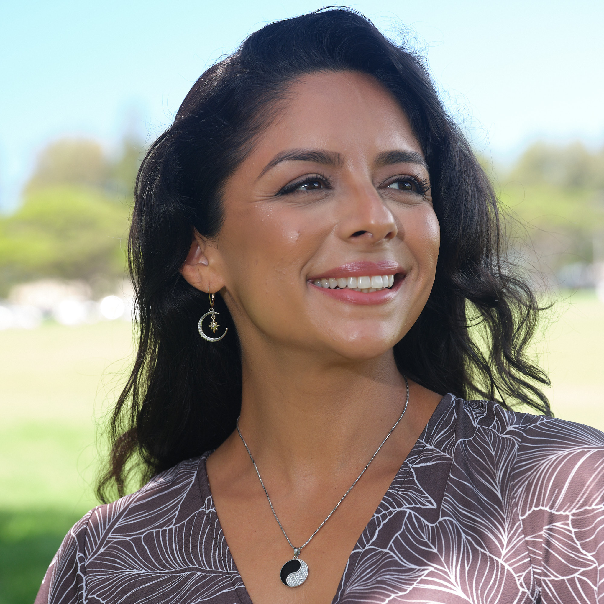 A woman wearing a Moon & Star Mermaid Earrings in Two Tone Gold with Diamonds - Maui Divers Jewelry