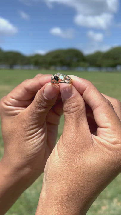 video product of a woman's hand wearing a Black Coral Ring with Opal in Gold-Maui Divers Jewelry