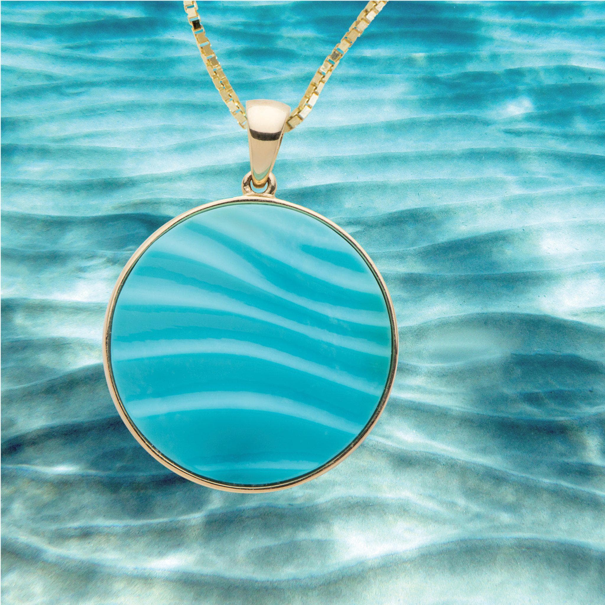 Hawaiian Moments Ocean Sand Pendant in Gold with Turquoise with ocean sand background