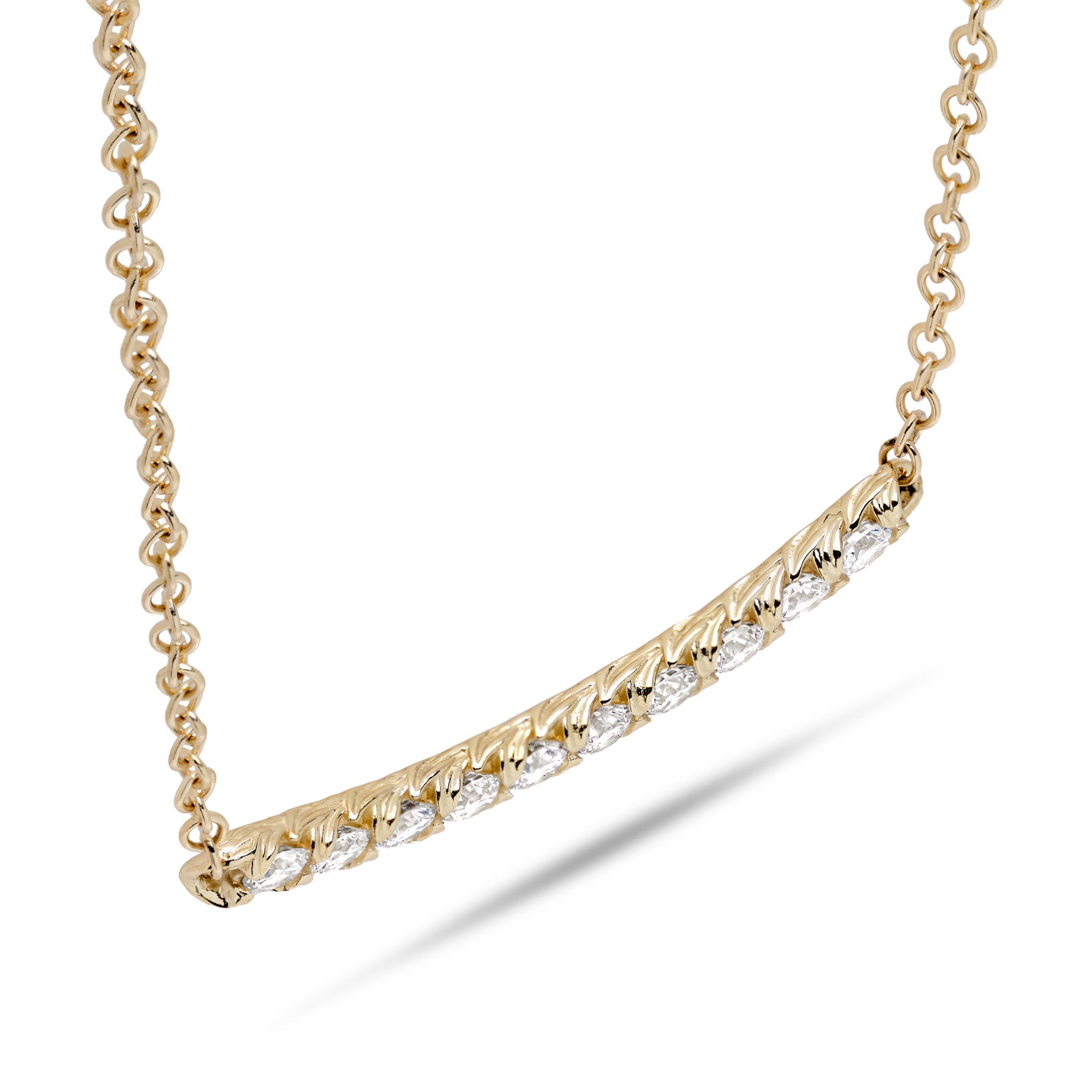 Close-up of the top of the Hidden Hawaiʻi necklace, showcasing the maile leaf prongs.