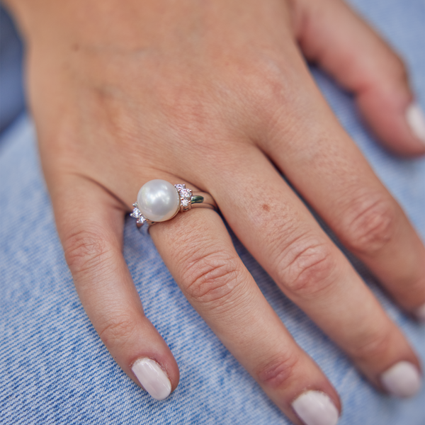 Hand on jeans wearing South Sea White Pearl Ring in White Gold with Diamonds - 10-11mm