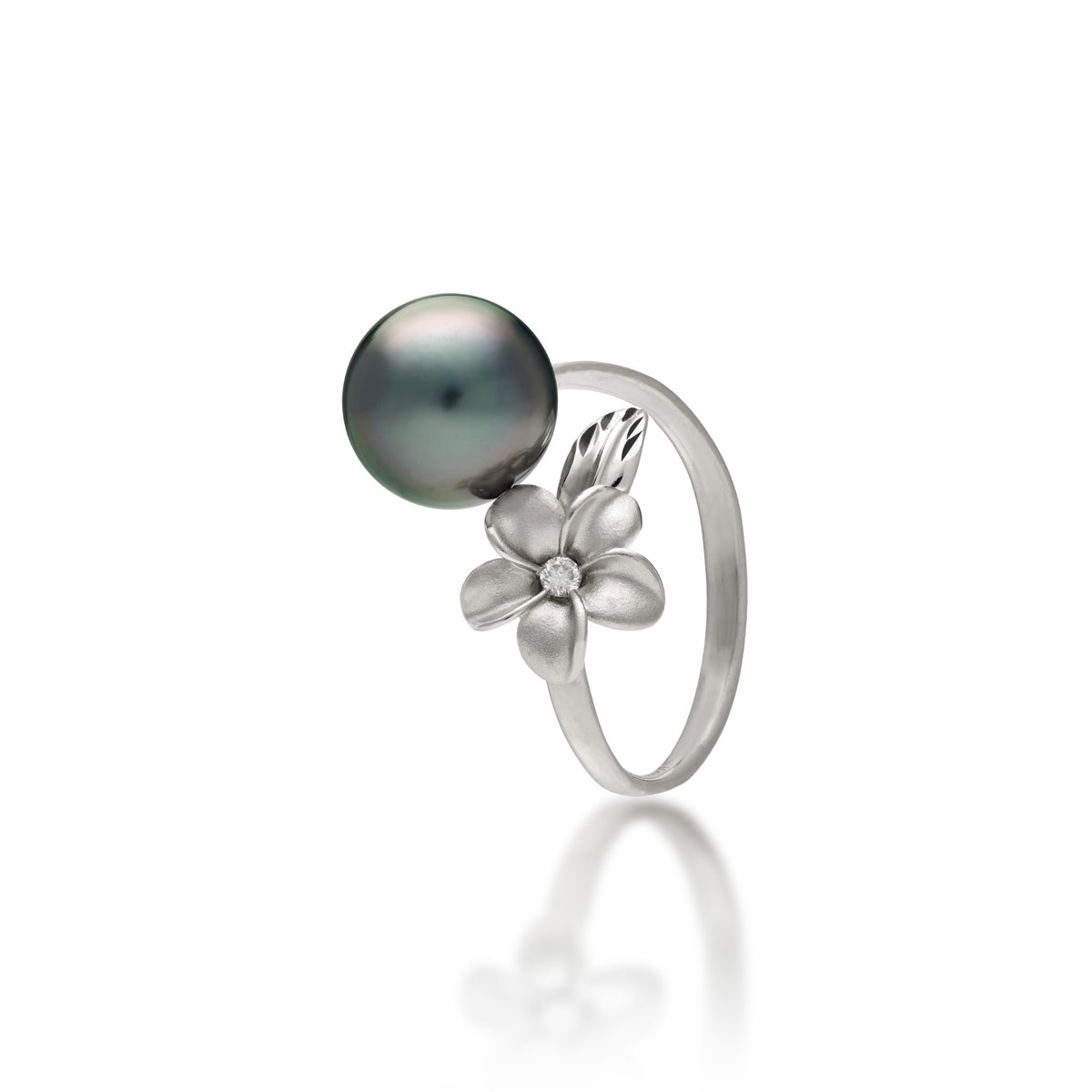 A 14k white gold bypass ring featuring a 10-11mm Tahitian black pearl and diamond-accented plumeria with a satin finish and diamond-cut leaf, set against a clean white background with a soft reflection.