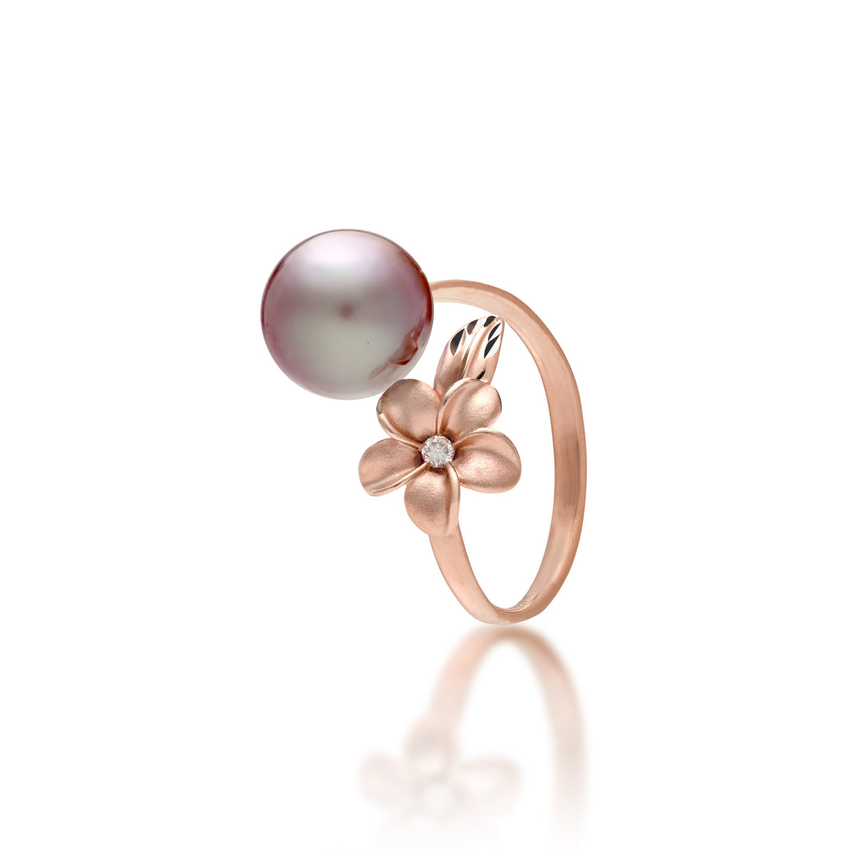 A 14k rose gold bypass ring featuring a 10-11mm lilac freshwater pearl and diamond-accented plumeria with a satin finish and diamond-cut leaf, set against a clean white background with a soft reflection.