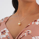 A woman's chest with a South Sea Golden Pearl Pendant in Gold - Maui Divers Jewelry