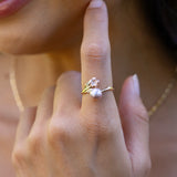 Close up of Pearls in Bloom Plumeria Lavender Freshwater Pearl Ring in Two Tone Gold with Diamond on finger