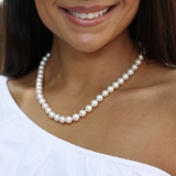 Woman wearing 18-19" White Freshwater Pearl Strand with White Gold Clasp by Maui Divers Jewelry 