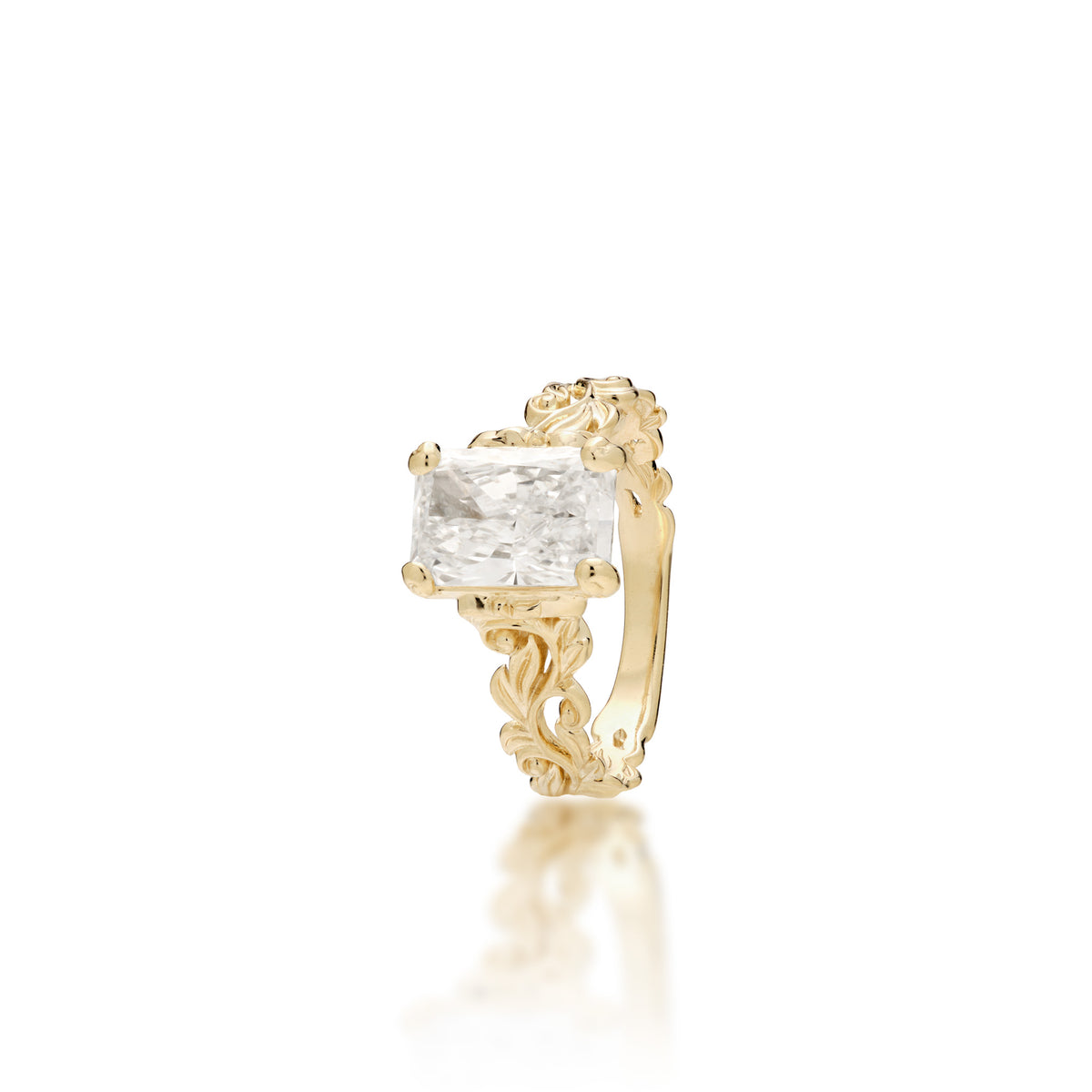 A 14k yellow gold Living Heirloom Collection engagement ring with a 2.04 radiant lab-grown diamond with maile leaf and hāpuʻu fern scrollwork, shown on a white background