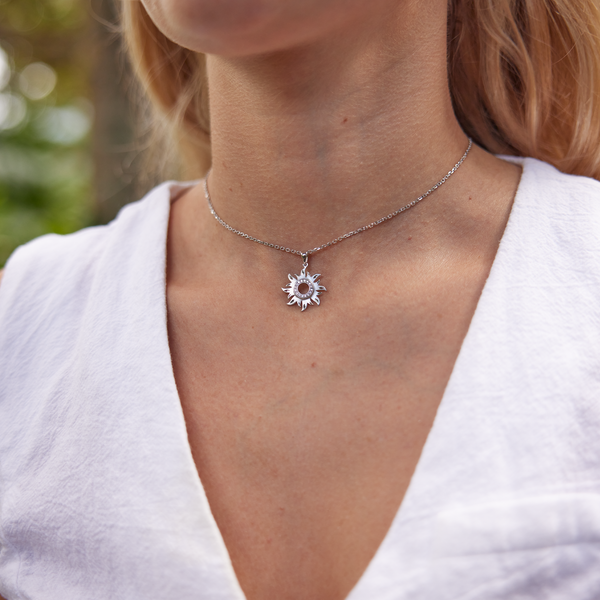 Woman's neckline wearing Sun Pendant in White Gold with Diamonds - 17mm
