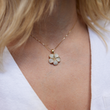 Close up of woman's neckline wearing Plumeria Pendant in Gold with Diamonds - 19mm