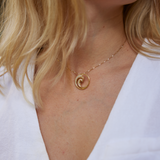 close up of neckline wearing Nalu Pendant in Gold with Diamonds - 22mm