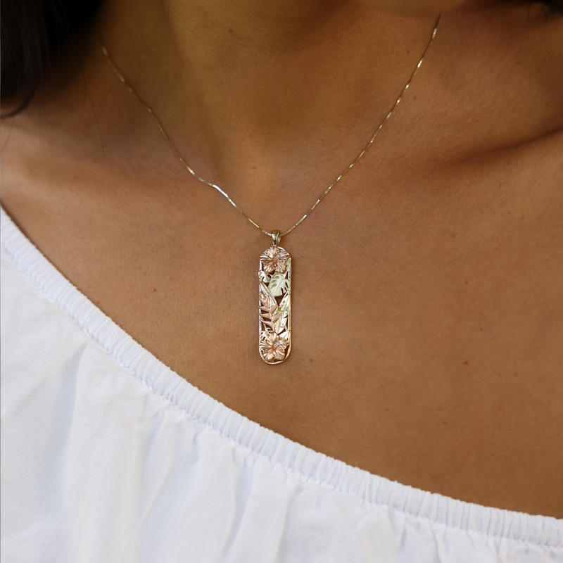 Model Wearing Hawaiian Gardens Hibiscus Pendant in Tri Color Gold with Diamonds - 39mm by Maui Divers Jewelry