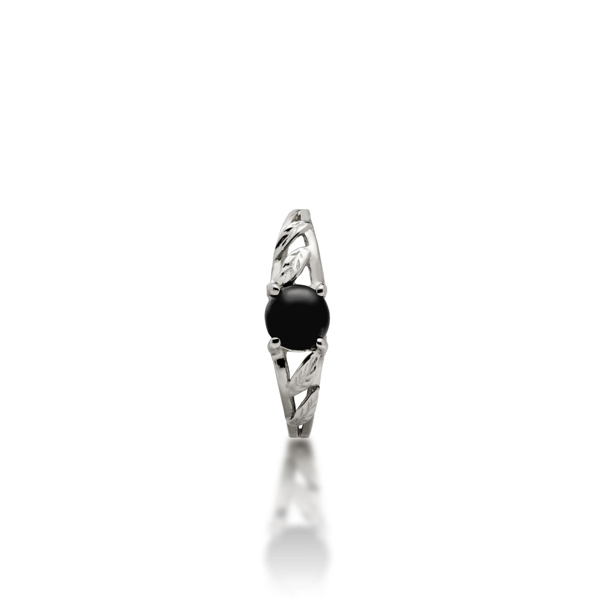 Front view of a maile leaves ring in white gold with a Hawaiian black coral cabochon set with four prongs, placed on a white background with soft reflection.