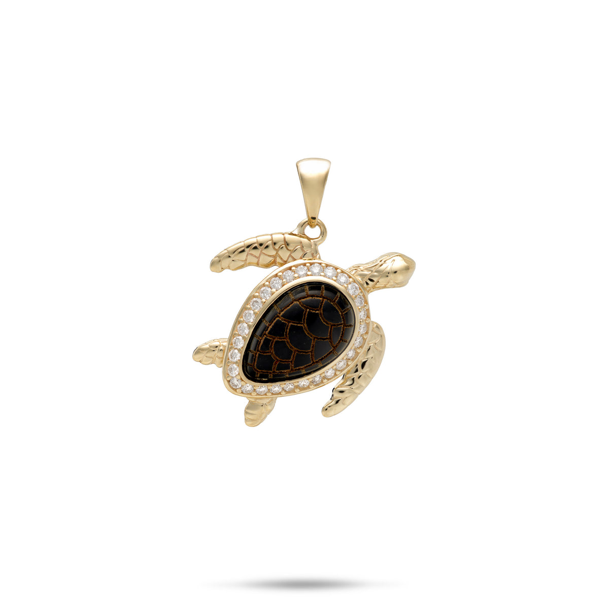 A Hawaiian green see turtle (Honu) pendant in 14k yellow gold with an etched Hawaiian Black Coral shell framed by a row of diamonds, placed on a background