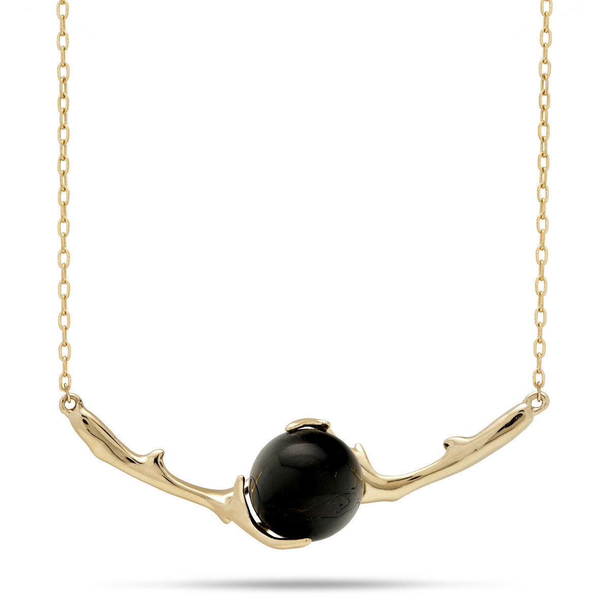 A 14k gold cable chain necklace featuring a polished Hawaiian black coral spherical bead set between a curved 14k gold coral branch, placed against a white background with a soft shadow.