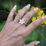 woman wearing Plumeria Mother of Pearl Ring in Gold - 16mm