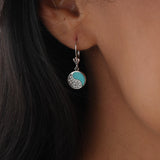 A woman's ear with Yin Yang Turquoise in White Gold with Diamonds - 10mm - Maui Divers Jewelry