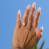A woman's hand with a Living Heirloom Engagement Ring in Gold with Diamonds - 10mm - Maui Divers Jewelry