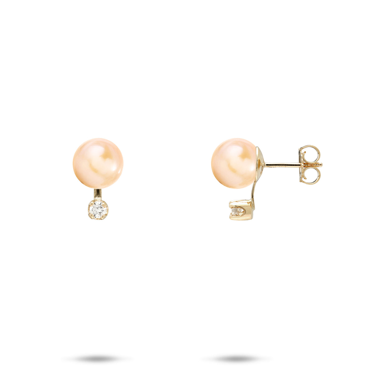 A pair of gold stud earrings featuring a round peach freshwater pearl and a diamond, shown on a clean white background with one earring facing forward and the other showing the post and backing.