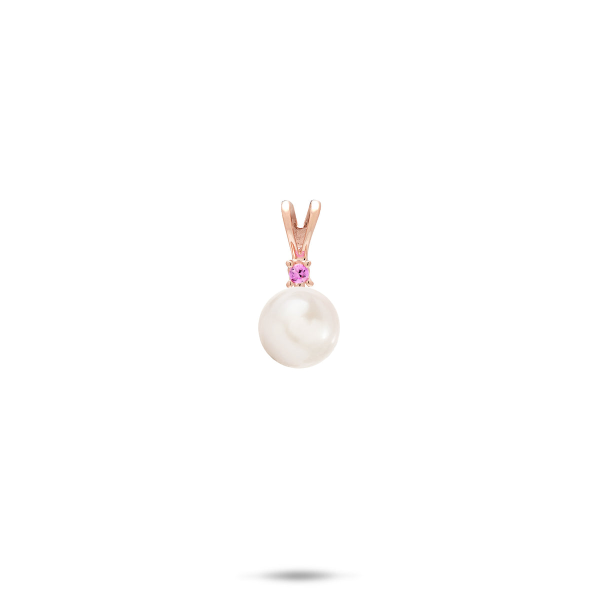 A simple 14k rose gold pendant with a V shape bail, a pink sapphire, and white freshwater pearl, shown on a white background