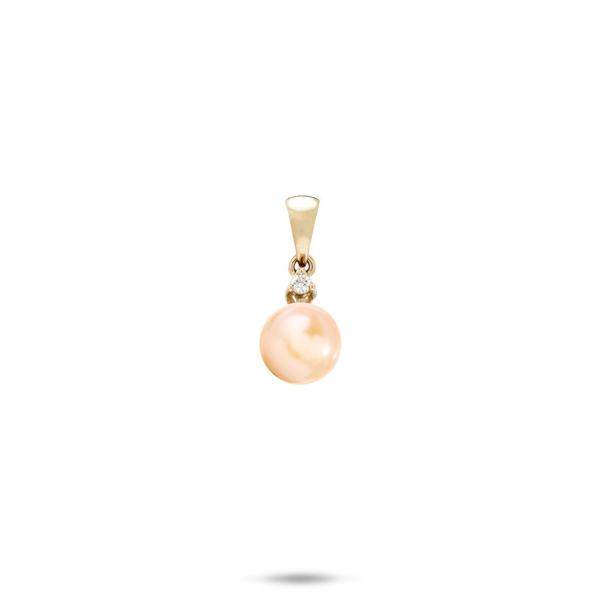 A simple 14k yellow gold pendant with a high-polish bail, dangling single diamond, and a peach freshwater pearl, shown on a white background